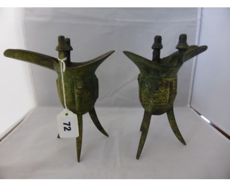 A pair of archaic style Chinese bronze ritual wine vessels, probably 20th century, Ju form, in the manner of Shang dynasty, h