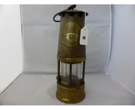 An original miners lamp "Protector of Eccles", plate inscribed 'The Protector Lamp & lighting Co Ltd Eccles, type SL, Ministr