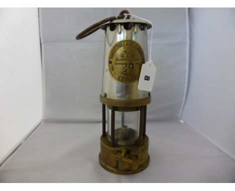 An original miners lamp "Protector of Eccles", stainless steel top plate inscribed 'The Protector Lamp & Lighting Co Ltd Eccl
