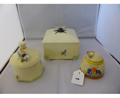 Clarice Cliff crocus pattern beehive honey pot, 3in. (7.6cm.) high, plus two Crown Devon honey pots. (3)