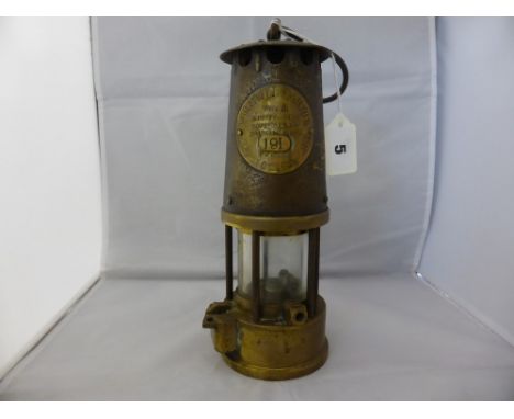 An original miners lamp "Protector of Eccles", plate inscribed "The Protector Lamp & Lighting Co Ltd Eccles, type SL, Ministr