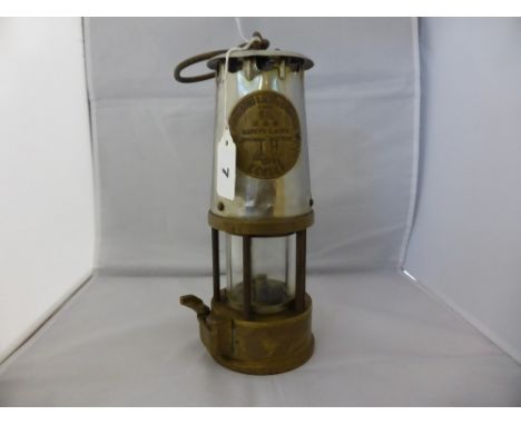 An original miners lamp "Protector of Eccles", stainless steel top plate inscribed 'The Protector Lamp & Lighting Co Ltd Eccl