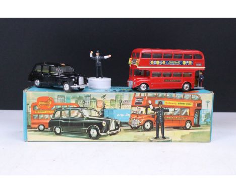 Boxed Corgi Gift Set No. 35 London Passenger Transport Set featuring 418 Austin London Taxi-Cab in black with driver, 468 Lon