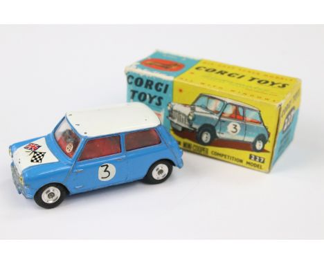 Boxed Corgi 227 Morris Mini Cooper Competition Model diecast model in blue with white roof and red interior, showing play wea