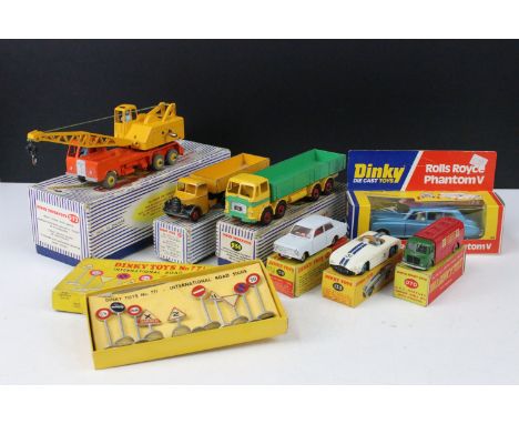 Eight boxed Dinky diecast models to include 921 Articulated Lorry in yellow, 124 Rolls Royce Phantom V in metallic blue, 133 