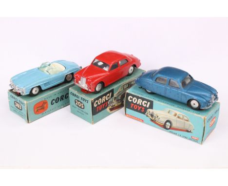 Three boxed Corgi diecast models to include 205 Riley Pathfinder Saloon in red with smooth hubs, 208M Jaguar 2.4 Litre Saloon