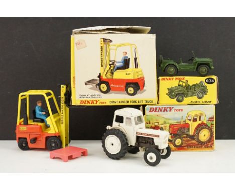 Three boxed Dinky diecast models to include 404 Conveyancer Fork Lift Truck complete with figure, 674 Austin Champ and 305 Da