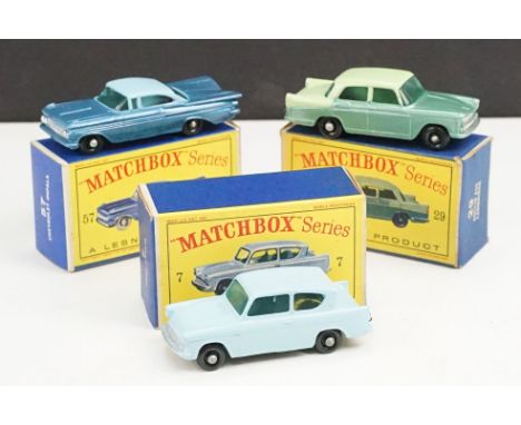 Three boxed Matchbox 75 Series diecast models to include 57 Chevrolet Impala in two tone blue, 29 Austin A55 Cambridge in two