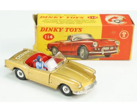 Boxed Dinky 114 Triumph Spitfire diecast model in gold, with driver, diecast &amp; decals vg, box with some storage squash bu