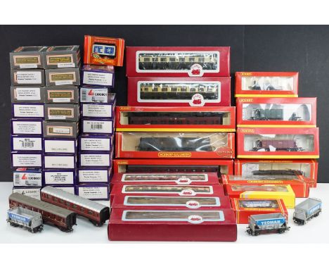 43 Boxed OO gauge items of rolling stock to include 29 x Dapol, 11 x Hornby, and 3 x Lima featuring coaches, wagons and vans 