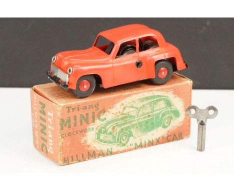 Boxed Triang Minic Clockwork Push And Go Hillman Minx in red, model in vg condition, box showing signs of age related wear