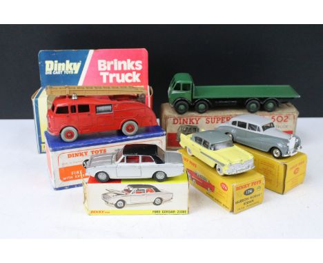 Six boxed Dinky diecast models to include Supertoys 502 Foden Flat Truck in green, 555 Fire Engine with extending ladder, 275