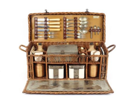 An early Sirram wicker picnic basket with many original contents