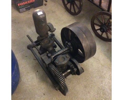 A vintage belt driven water pump, on local farm from new.