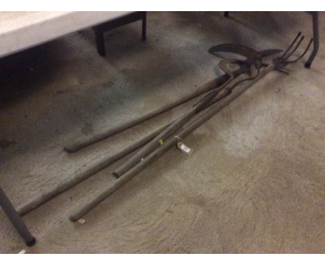 Four various vintage long handled tools