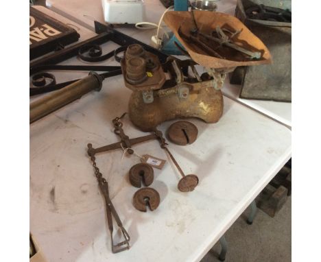 A set of iron 7lb kitchen weights; an old iron hanging scale etc.