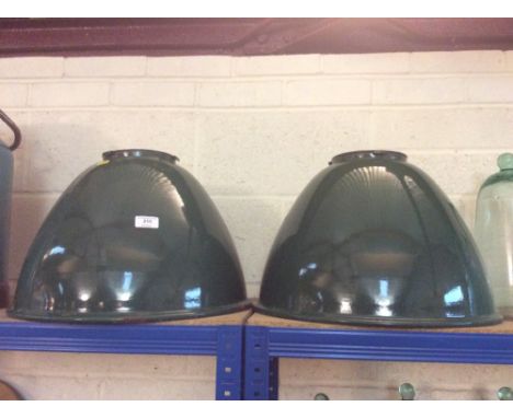 A pair of large green enamelled light shades
