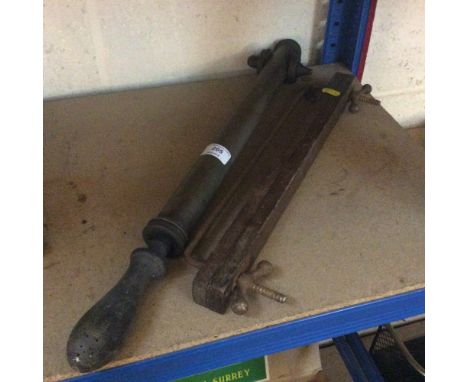 A brass garden sprayer and a tie rack 