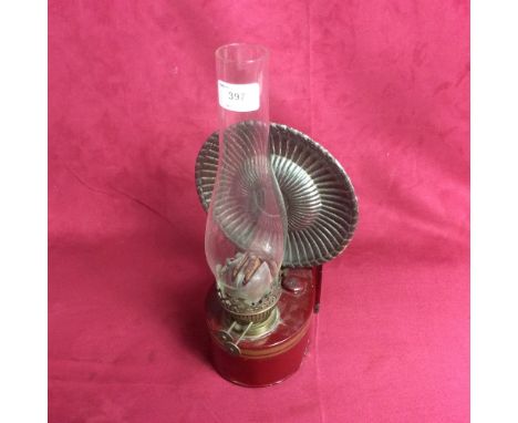 A vintage wall oil lamp