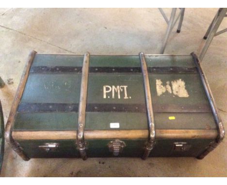 A wooden and metal bound steamer trunk, initialled PMcI