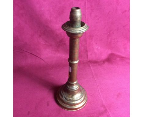 A vintage patent brass candlestick