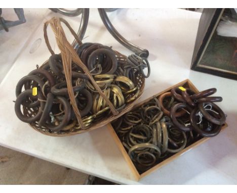 A large quantity of various wooden, brass and other vintage curtain rings