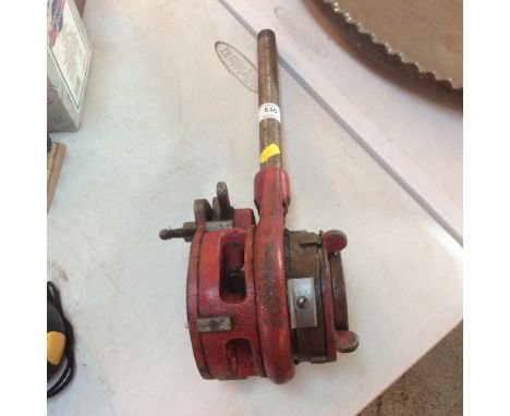 An adjustable pipe threader