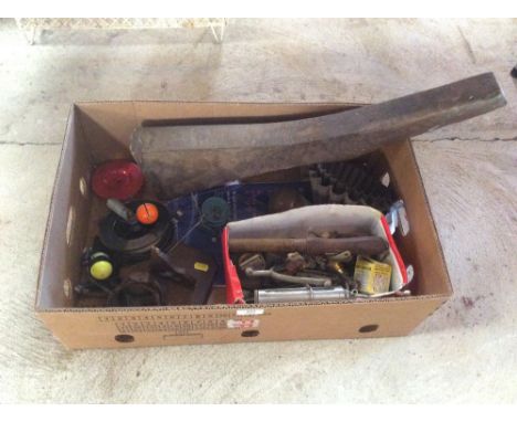 A box of miscellaneous items to include fishing accessories, old tin jelly moulds, spurs, oil lamp parts etc.