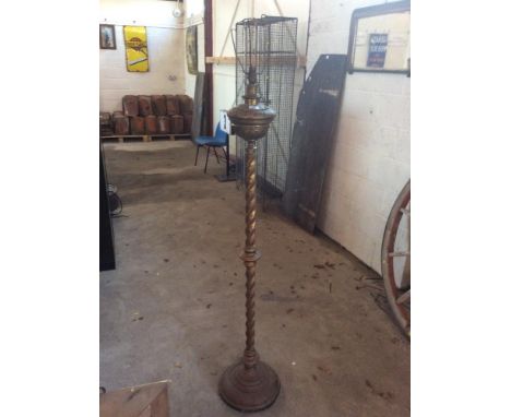 An ornate Victorian brass standard oil lamp, (later converted)