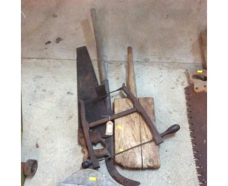 An old malt shovel; two vintage saws and a bill hook