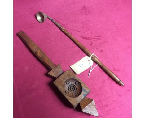 A small wooden and brass ladle and a carved wooden pastry mould