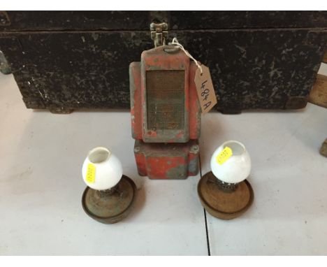 A pair of small oil lamps and an unusual shaped oil lamp