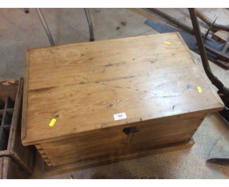 A stripped pine trunk fitted iron side carrying handles, 64cm wide