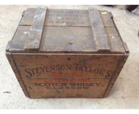 A large wooden storage box printed with Stevenson Taylors Scotch Whisky of Glasgow