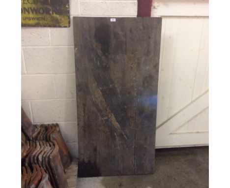 A vintage folding table, circa World War II, with metal folding trestle supports