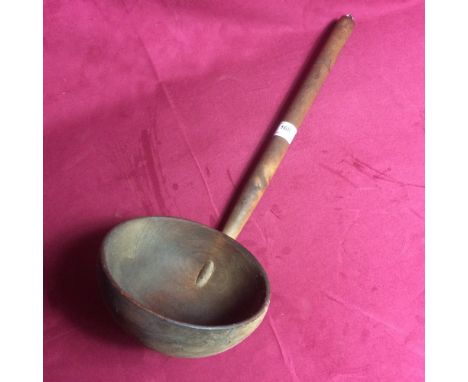 A large wooden ladle