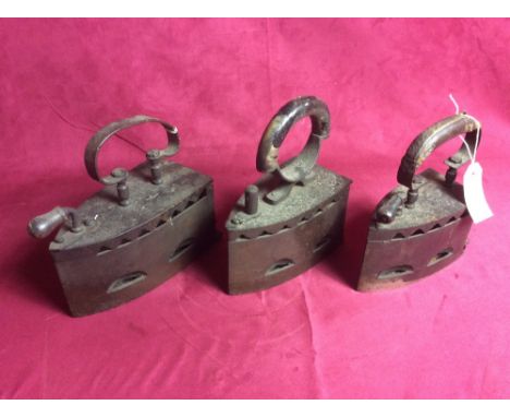 Three large vintage flat irons
