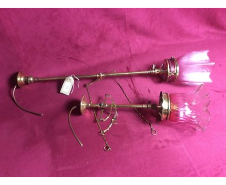 Two converted brass gas ceiling lights with ruby tinted shades