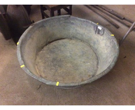 An antique shallow copper planter, 84cm diameter