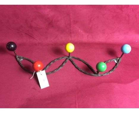 A vintage iron coat rack