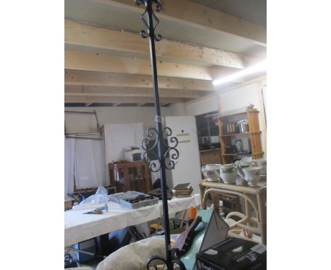 An ornate metal standard lamp (no shade)