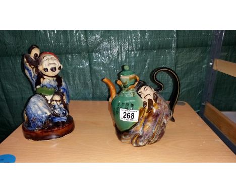 A Chinese figural pottery teapot &amp; a figure