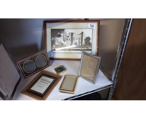 A black and white print of Newark Castle and various pictures and photo frames. 