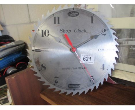 A Craftsmans Tools clock in the shape of a saw