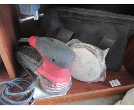 A Skil sander with discs and bag