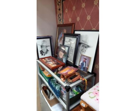 A quantity of John Wayne related items including LE of 95 John Wayne knife a/f, bugle, plaque, framed and glazed pictures etc