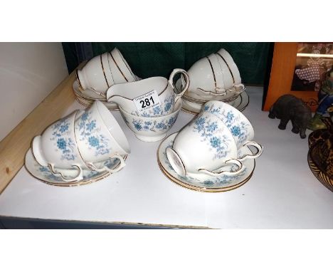 A Royal Stafford and Colclough cups and saucers