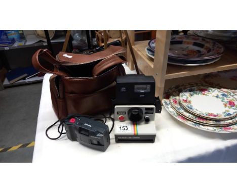 A vintage Polaroid 1000 Land Camera &amp; a quantity of Olympus MD cameras