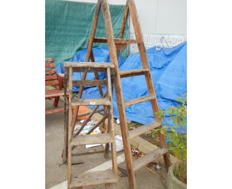 2 wooden step ladders
