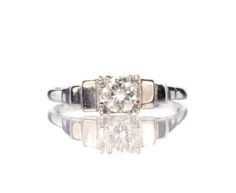 A Diamond solitaire ring set in 18ct white gold, with graduated step shoulders. Approximate carat weight 0.50ct, Ring size N/